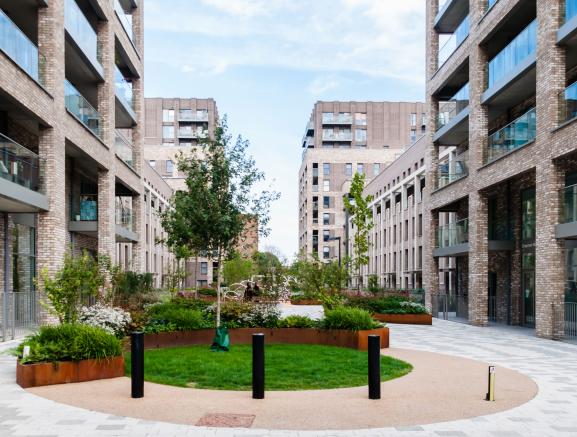 Modern apartment block of flats with communal garden