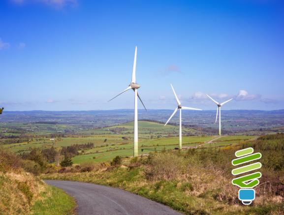 Landscape with wind farm on a blue sky